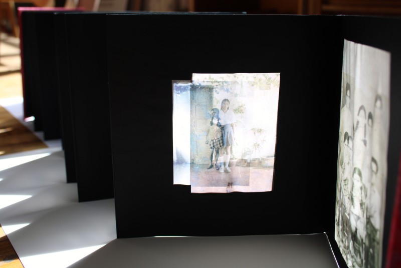 The images in the photo album are transparent so that light can shine through them revealing a double image