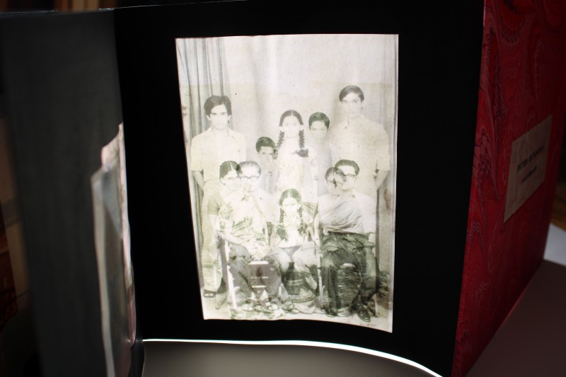 The images in the photo album are transparent so that light can shine through them revealing a double image