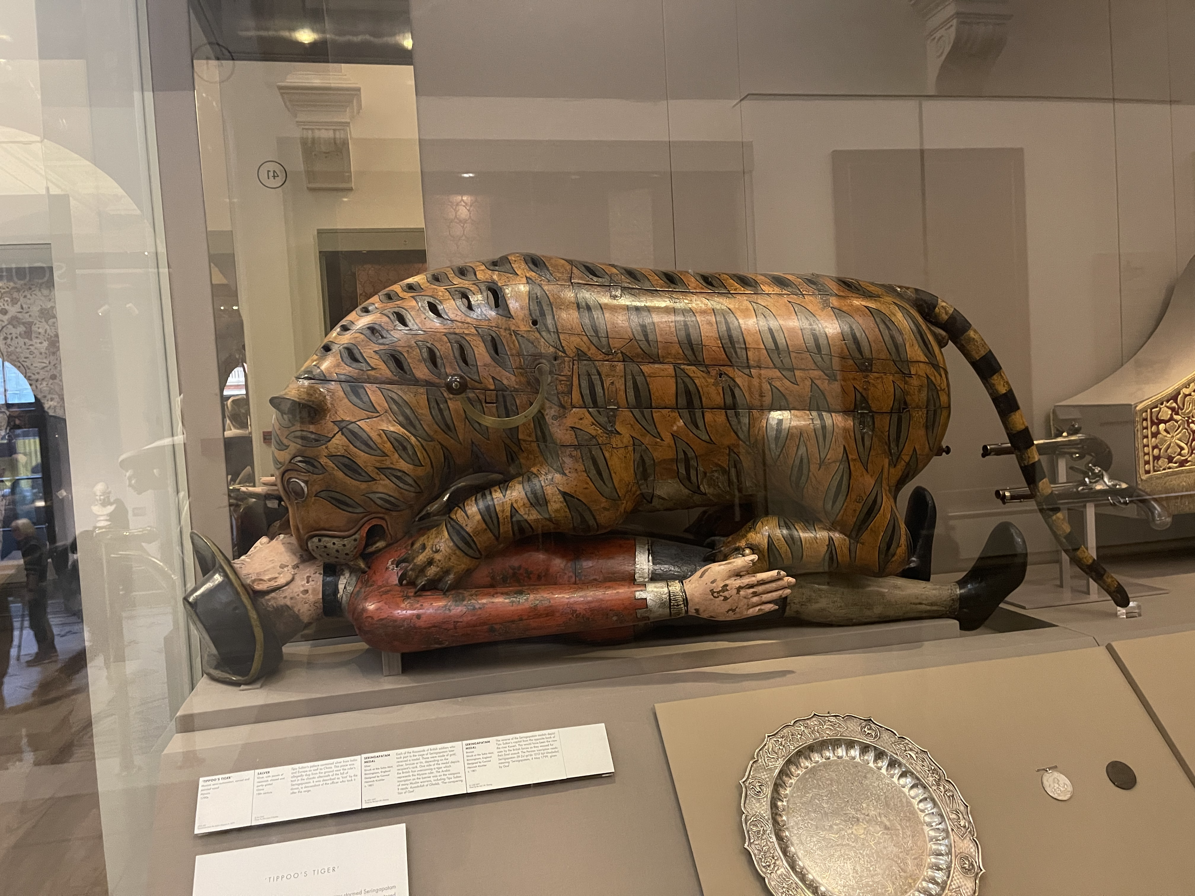 An automata of a tiger mauling a british soldier.